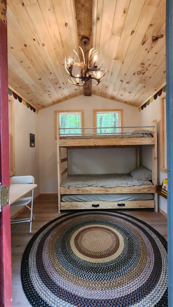 Cozy cabin interior with bunk beds.