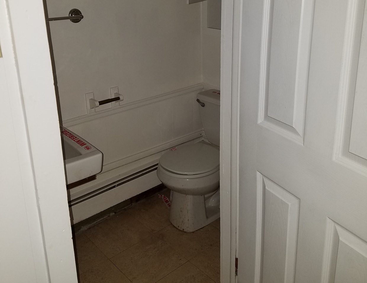 Small bathroom with toilet and sink.