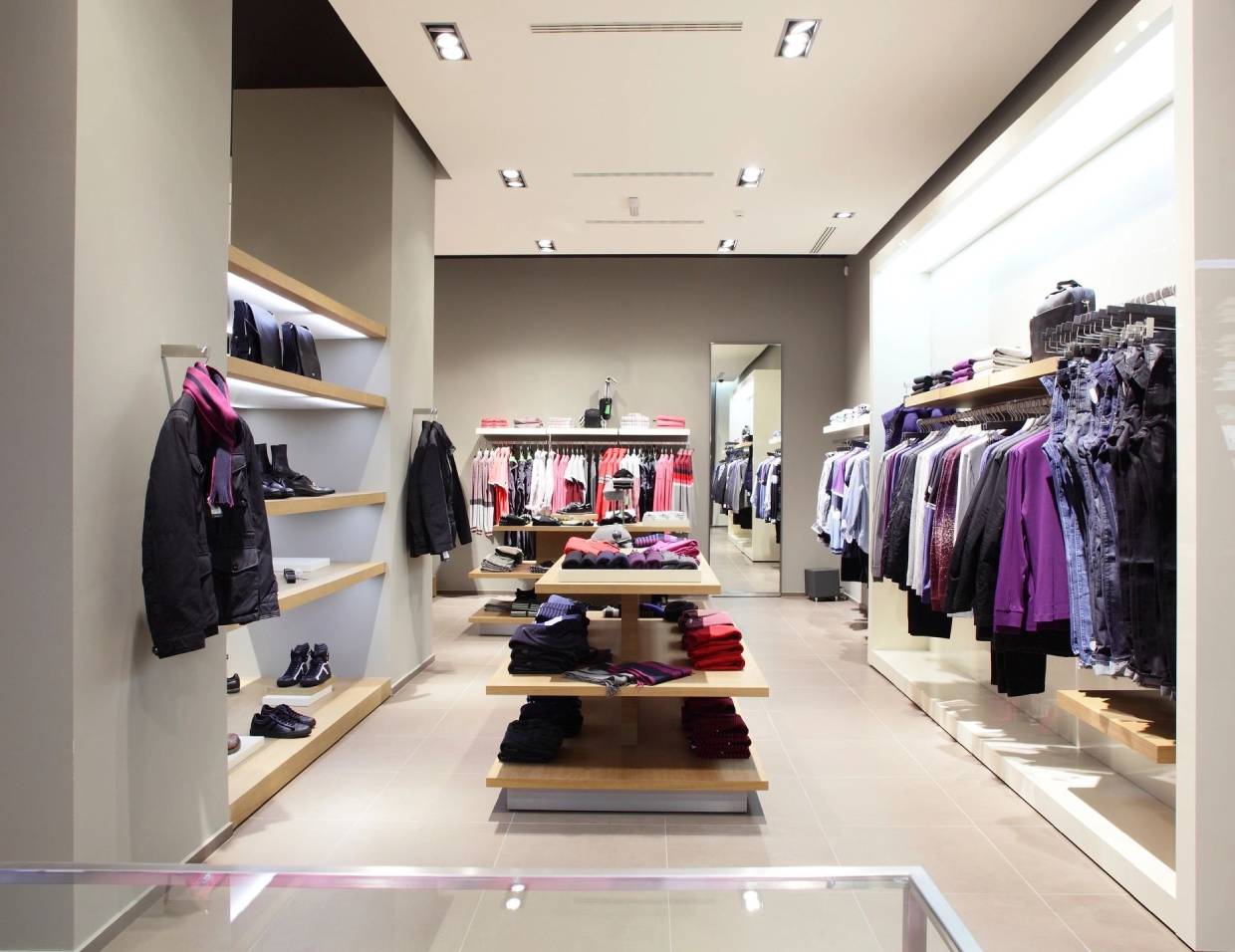 Clothing store with neatly arranged garments.