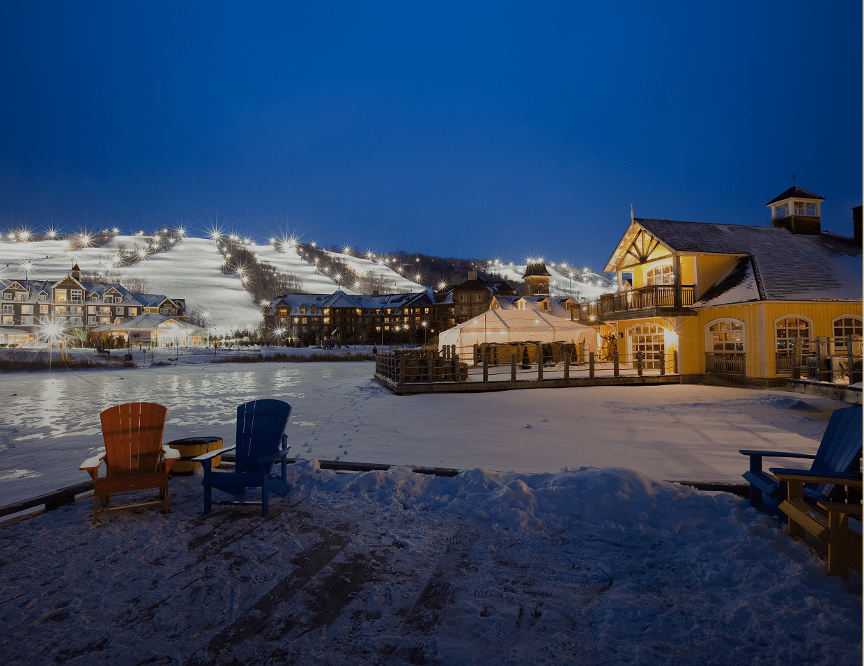 Snowy ski resort at night